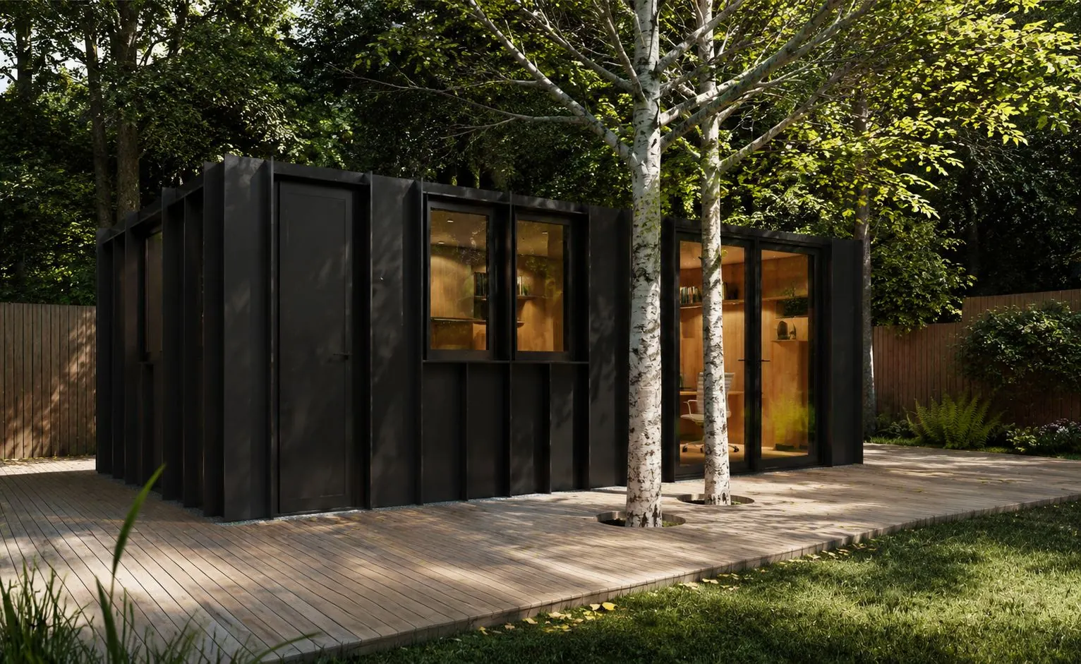 A black-clad garden studio among silver birch trees, lit warmly from inside